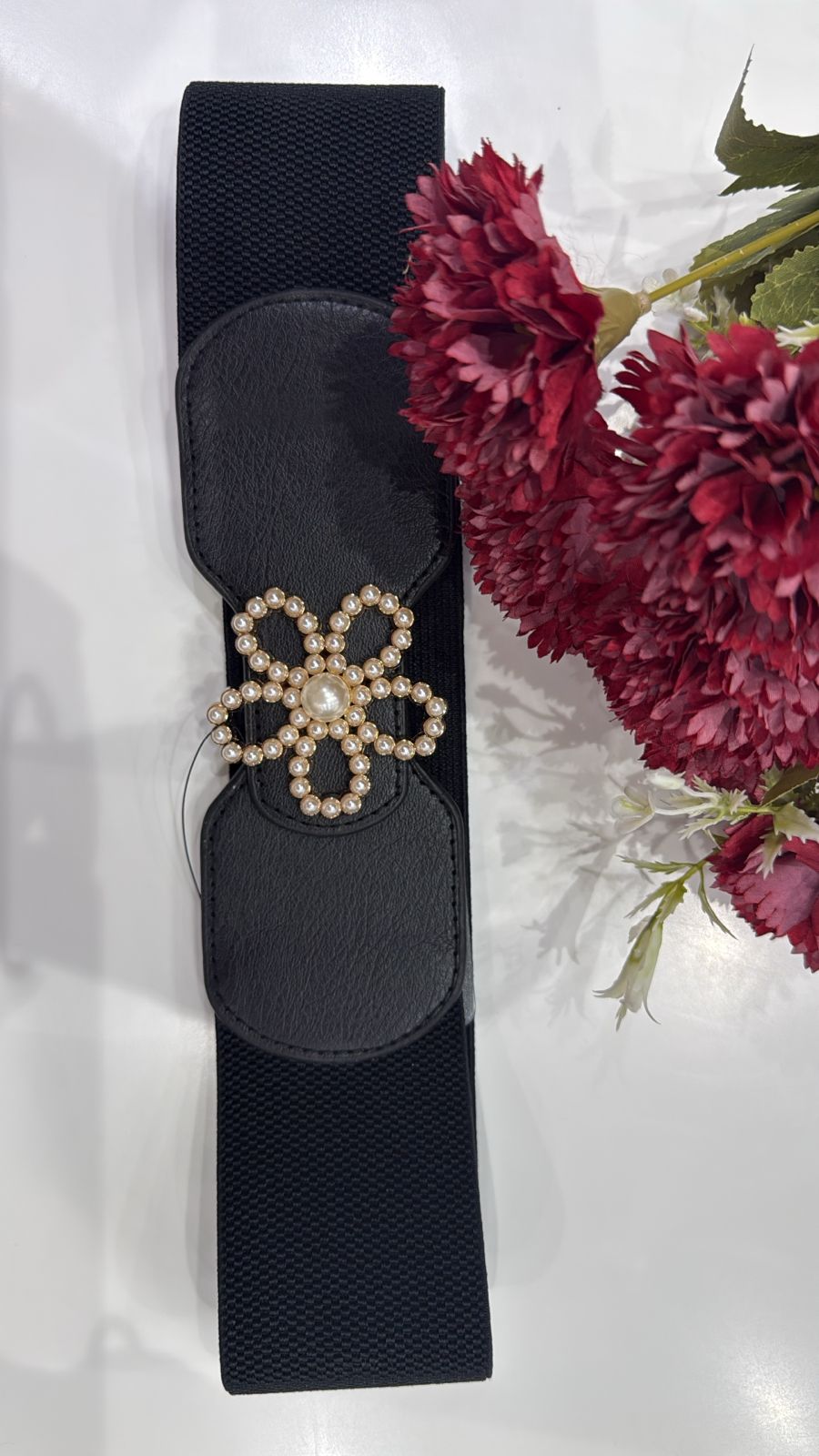 Waist belt with an elegant gold statement buckle